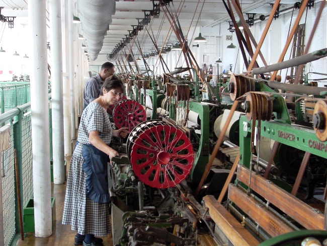 Weavers at work on the looms