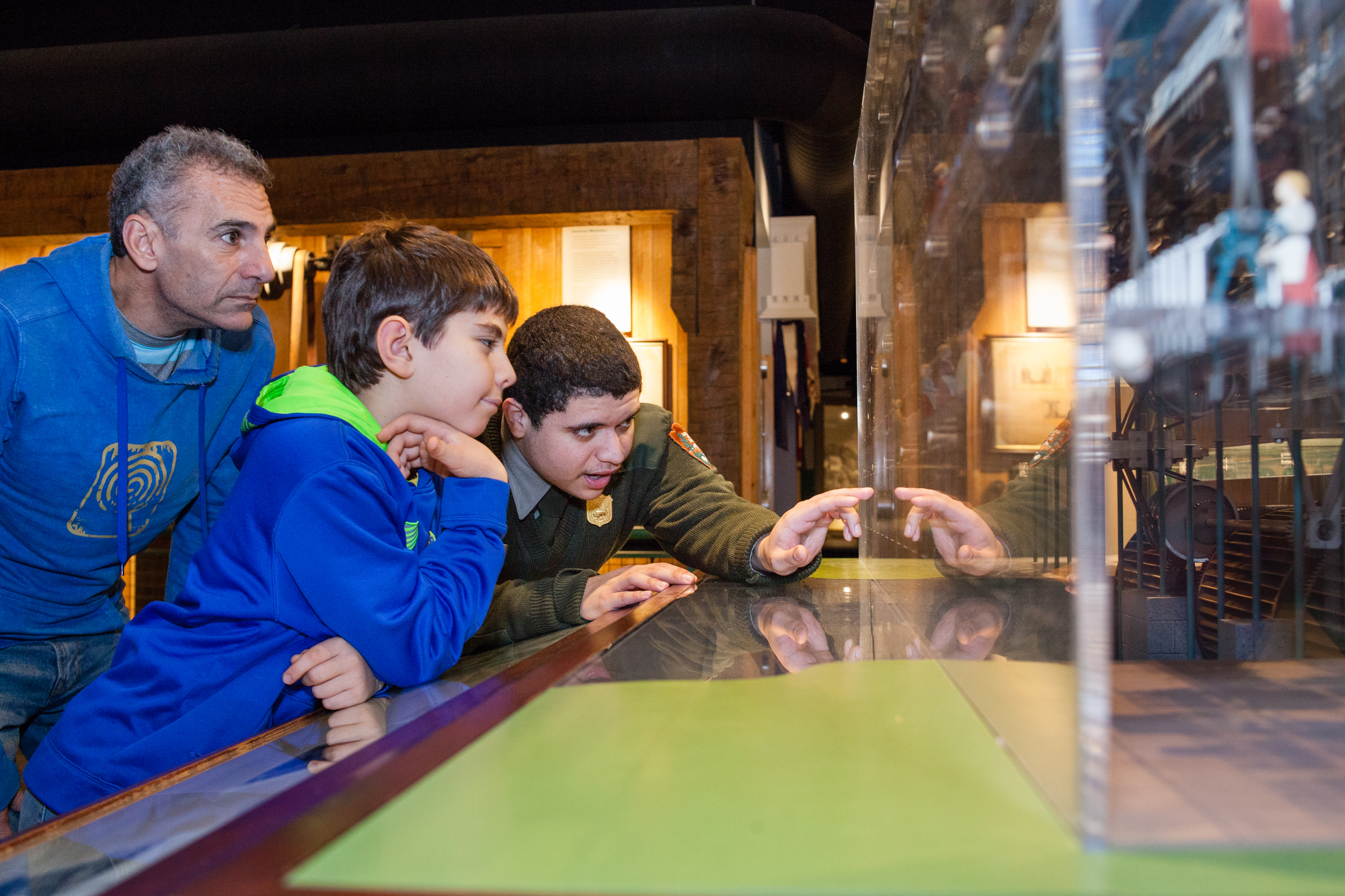 The Mill Model. Father and son get a detailed talk about mills with the transparent model. Father and son get a close look at a mill. A park ranger explains the model in detail