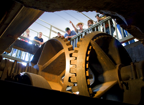 A ranger stands over a turbine pit