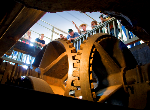 A ranger stands over a turbine pit