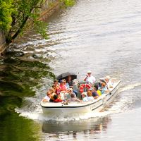 Visitors and captain on a boat tour of the canals