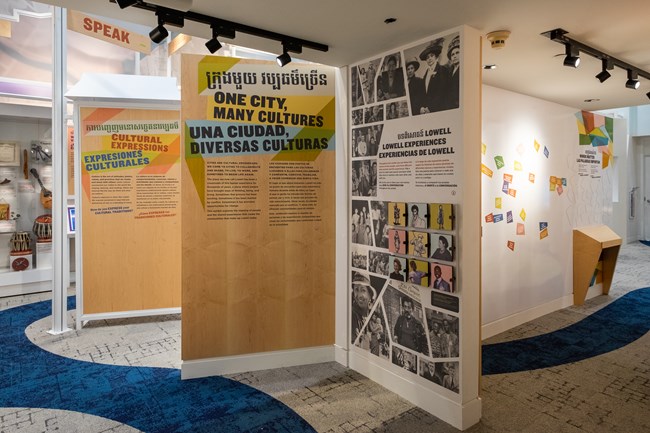 Entrance to an exhibit featuring walls with text and images.