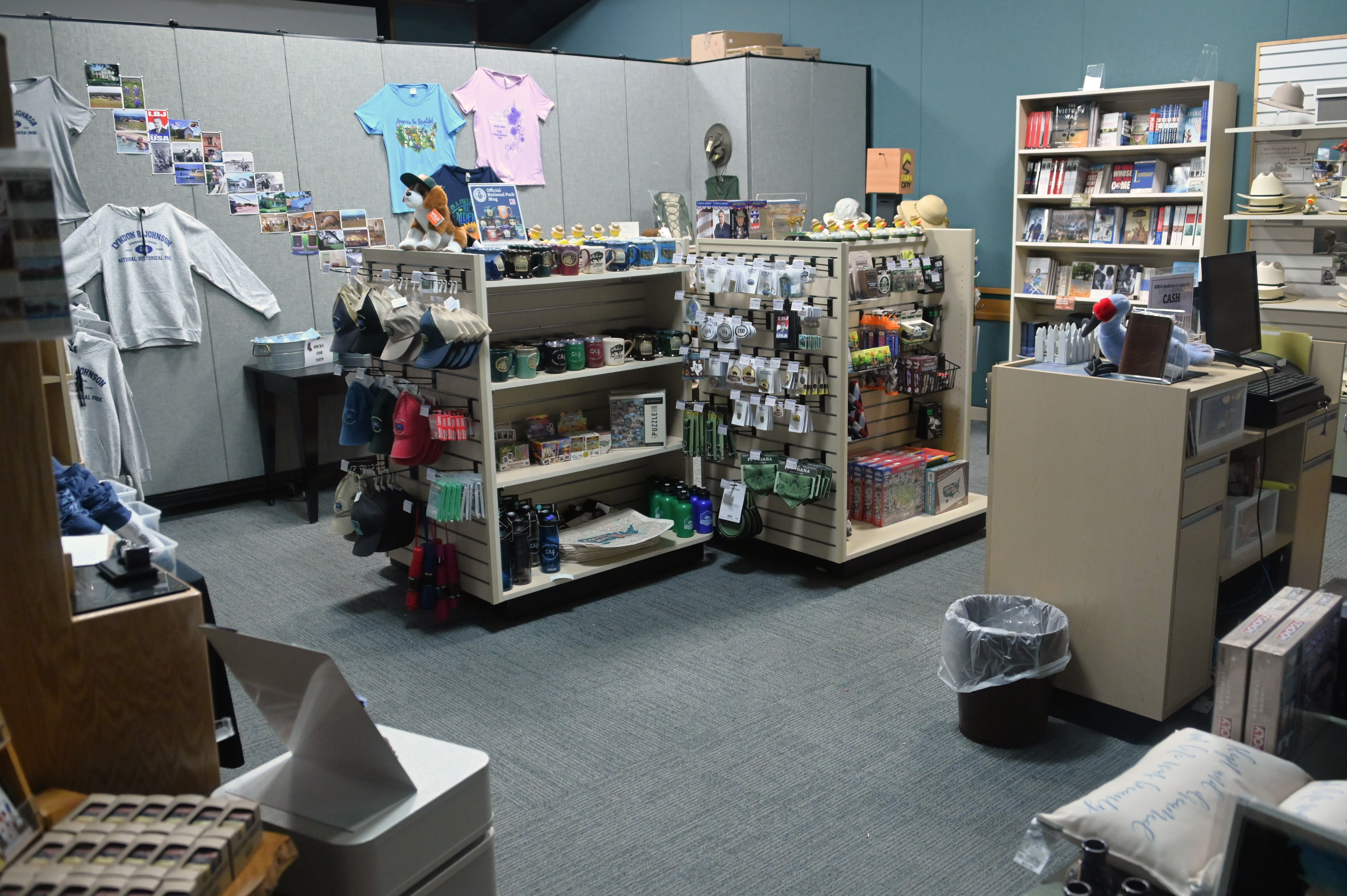 Several sets of shelves display books, plush animals, and other items.