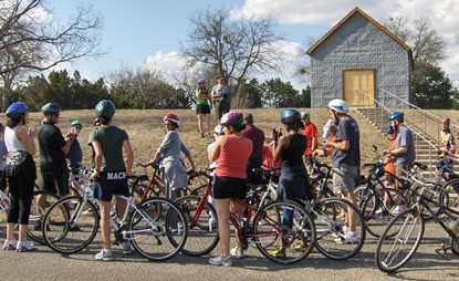 Luci Johnson speaks to cyclists outside the Junction School on the LBJ Ranch. Luci Johnson speaks to cyclists outside the Junction School on the LBJ Ranch.