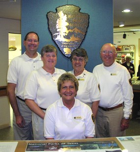 Park volunteers greet visitors at the information desk. Park volunteers greet visitors at the information desk.