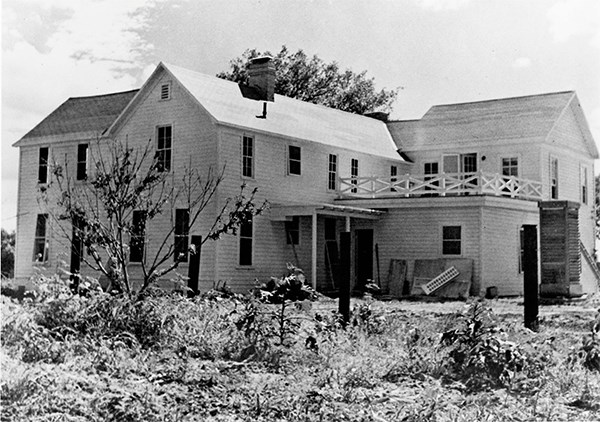 A two-story frame house with a second-story deck.