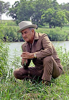 Lyndon Johnson kneeling on the banks of the Pedernales River Lyndon Johnson kneeling on the banks of the Pedernales River