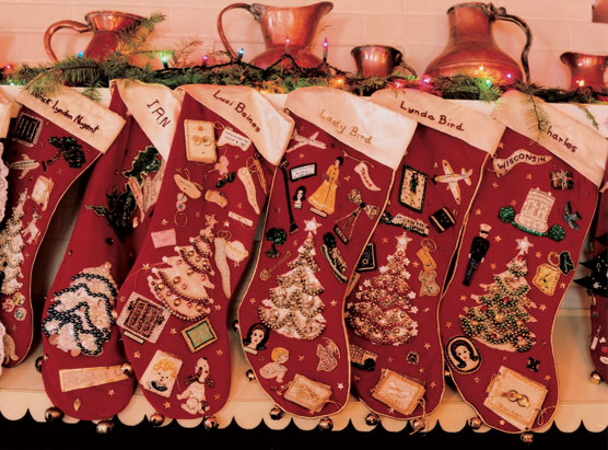 Fireplace mantel in the Texas White House covered with Johnson family Christmas stockings.