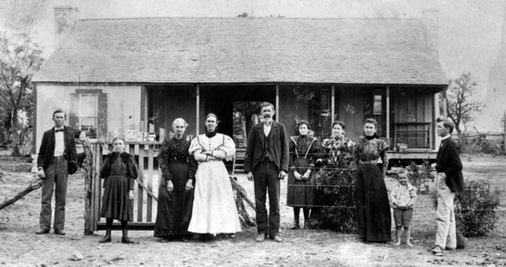 The Johnson family stands in front of the Birthplace in 1897