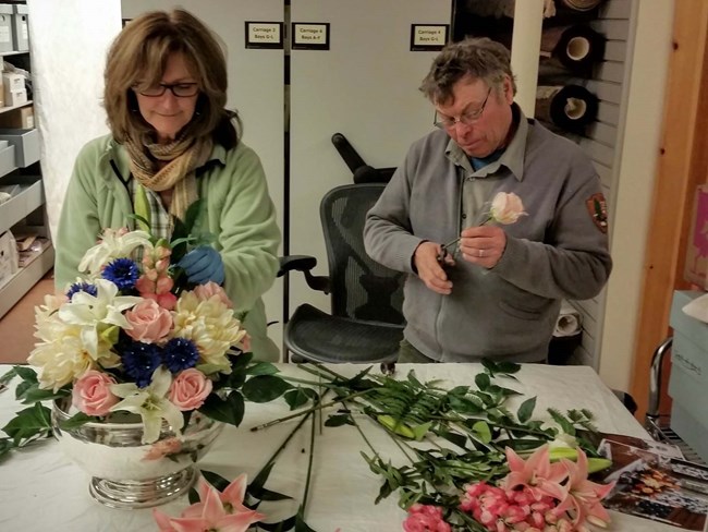 Reconstructing a Rockefeller-era silk flower table decoration, working from a photograph