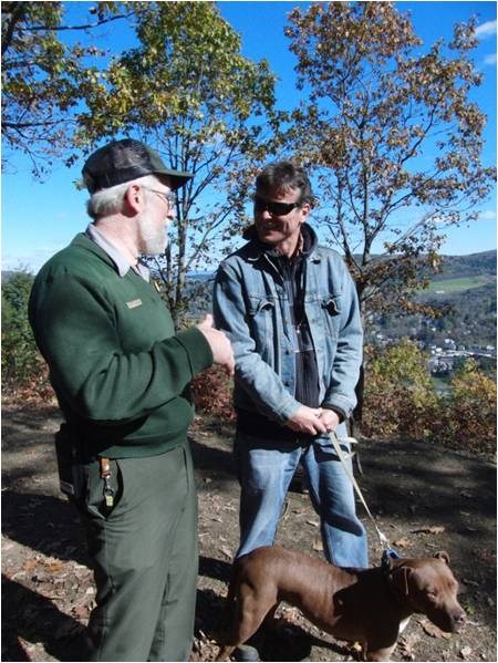 Ranger at Marsh-Billings-Rockefeller Mount Tom with hiker who has a dog on leash