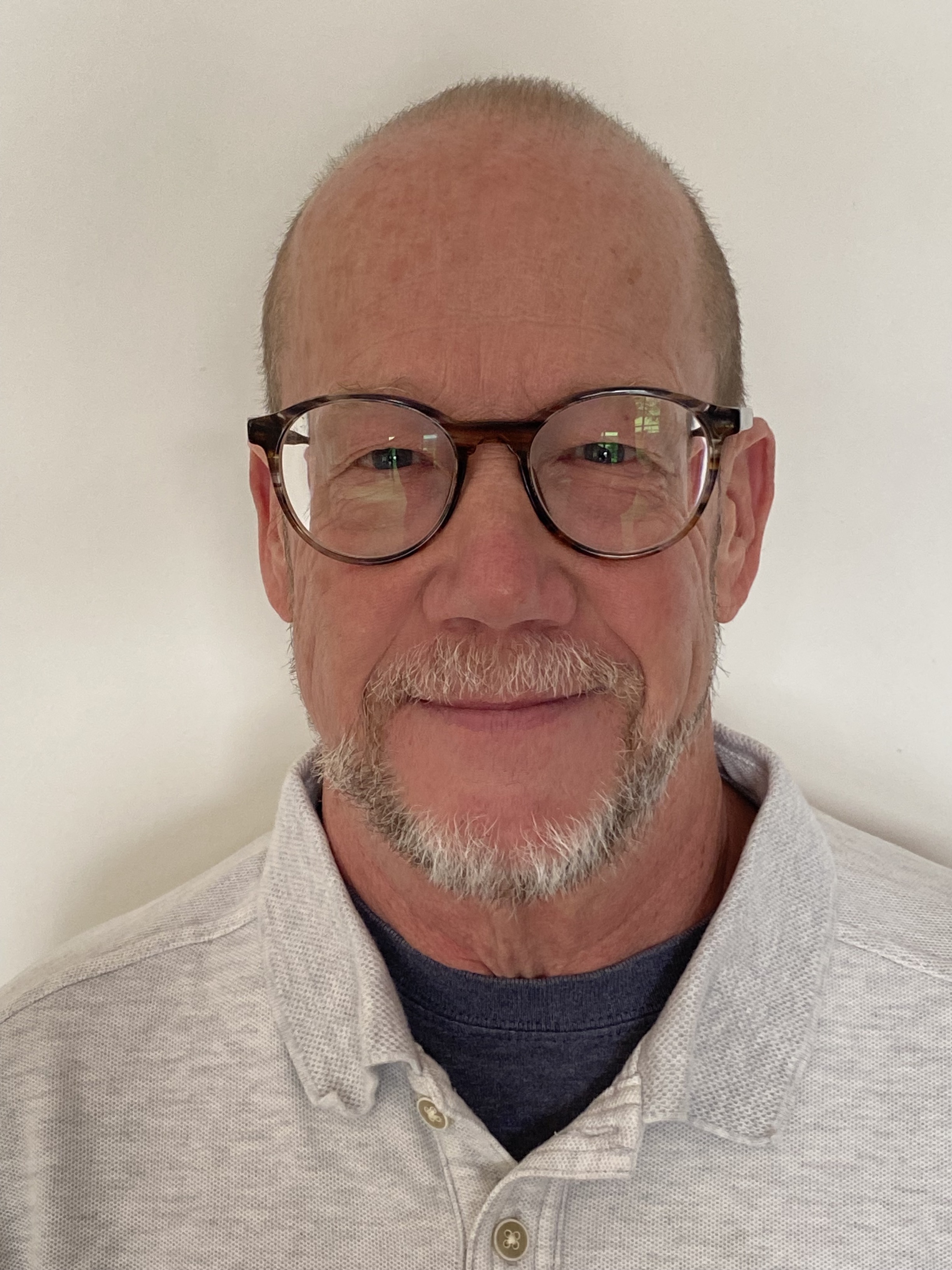 headshot of man looking at camera