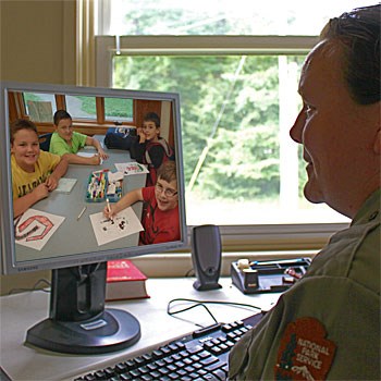 A park ranger visits a school class through distance learning. A park ranger visits a school class through distance learning.