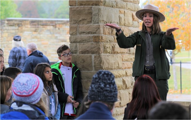 A park ranger talks to a group of visitors.