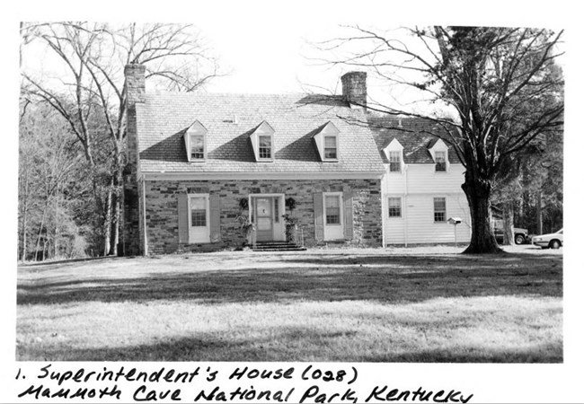 A black and white photo of a historic house.