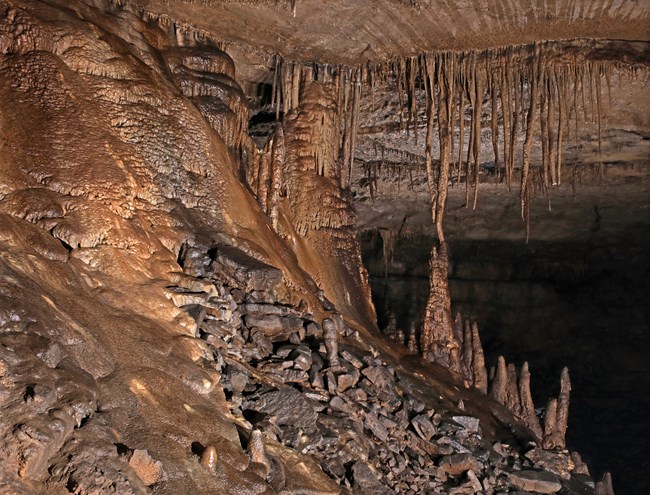 Stalactites hanging from the cave ceiling.