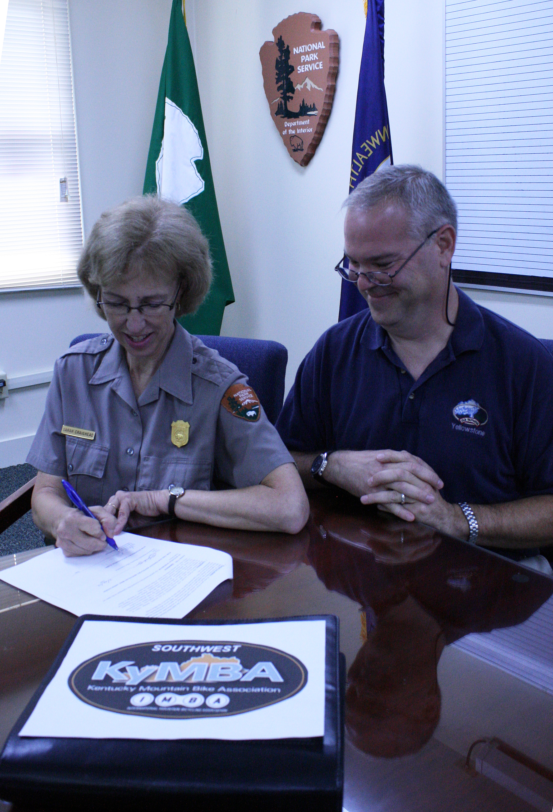 Craighead and Winger sign agreement for mountain bikers to maintain Big Hollow Trail. Craighead and Winger sign agreement for mountain bikers to maintain Big Hollow Trail.