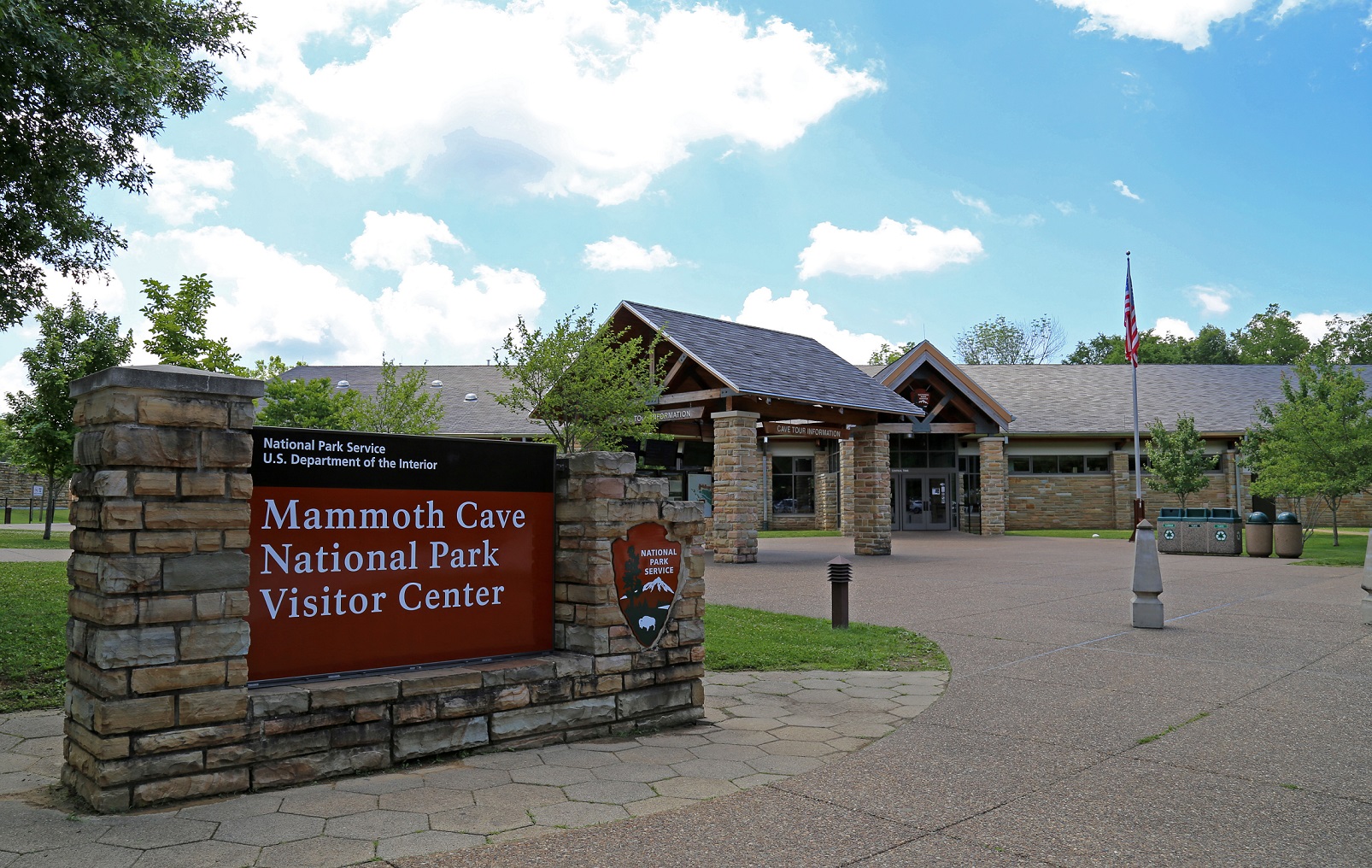 Mammoth Cave National Park increases recreational access to visitor center and cave tours Image of large Mammoth Cave National Park Visitor Center sign with building and flagpole in the background.