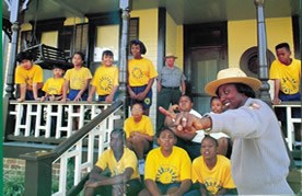 Park ranger makes a point with a class of schoolchildren at the Birth Home.