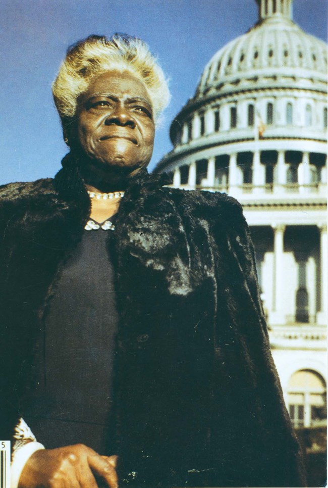 Mary McLeod Bethune stands outside the United States Capitol dome, 1949