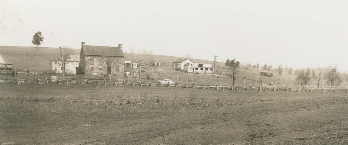 baclk and white image of the Stone House in the 1930s and the surrounding area