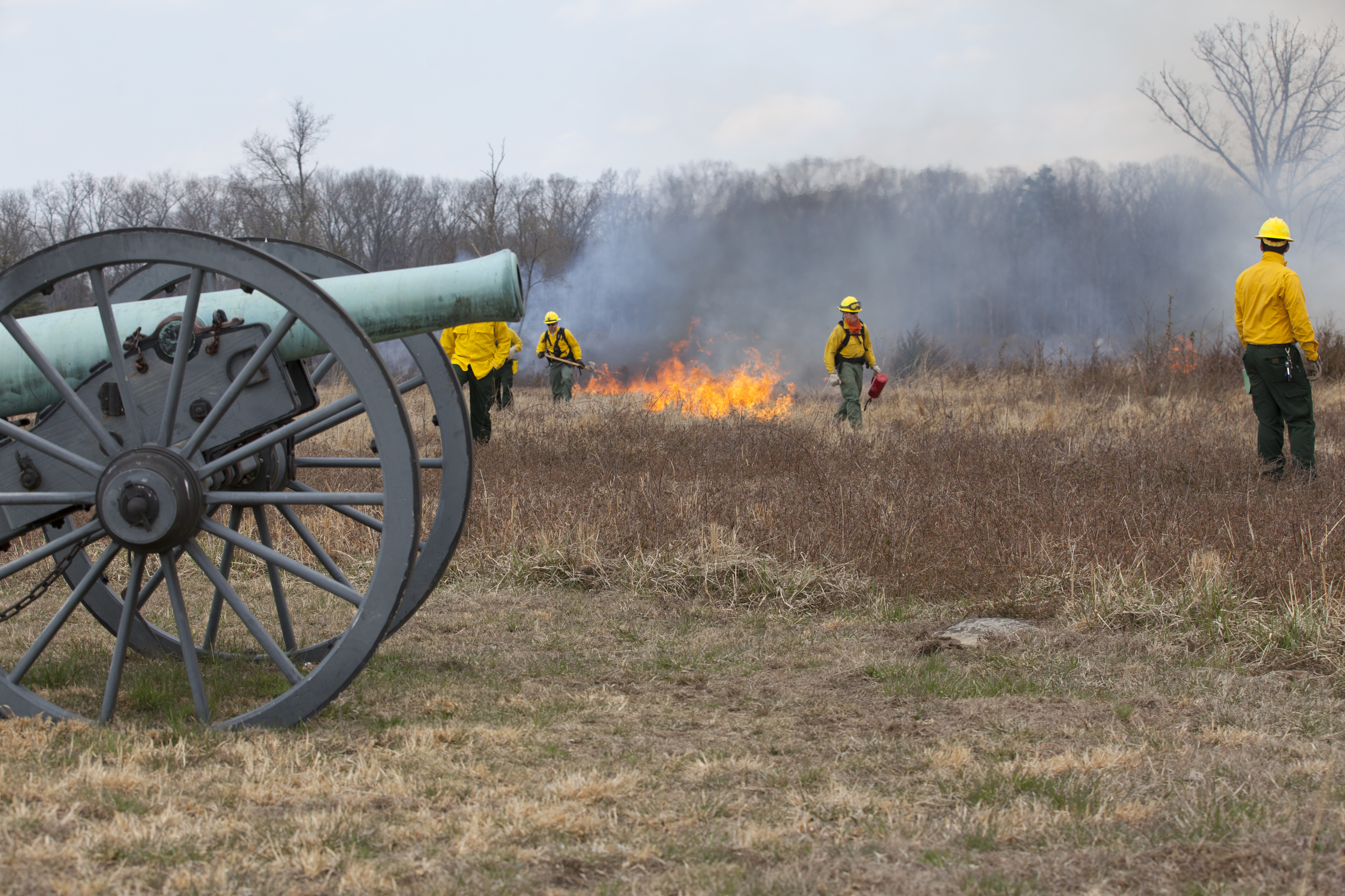 Wildland firefighters at Manassas National Battlefield Park Several wildland firefighters near a historic cannon