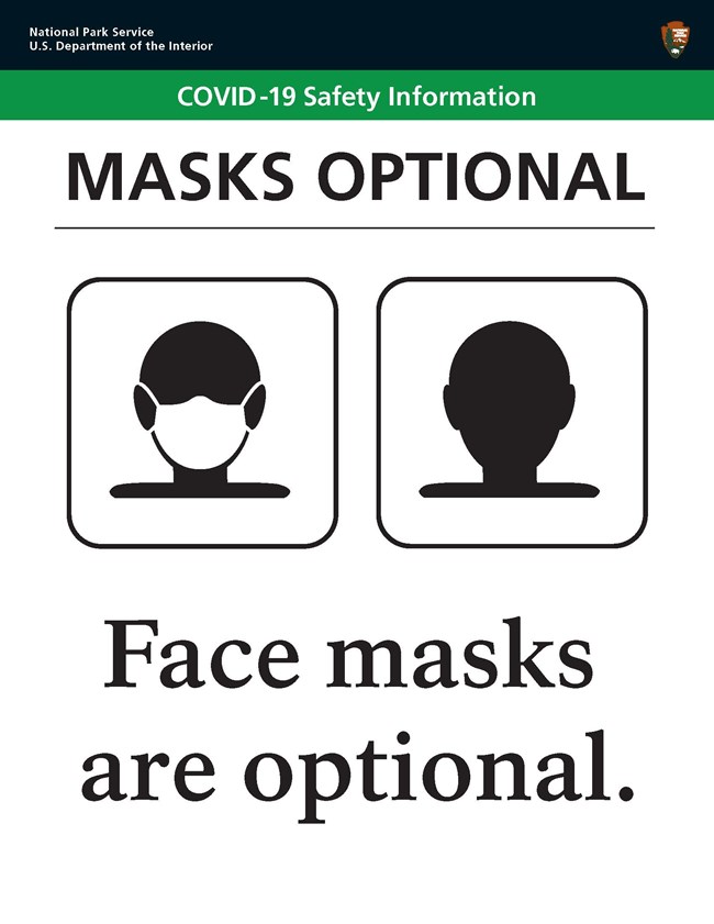 NPS sign with black bar that shows a face masked/unmasked and reads "Face masks are optional."