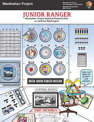 Cover of Junior ranger book including U235 Fission, the guide for this book, sits in a chair in front of the controls. Atom appears as a humanized atom symbol.