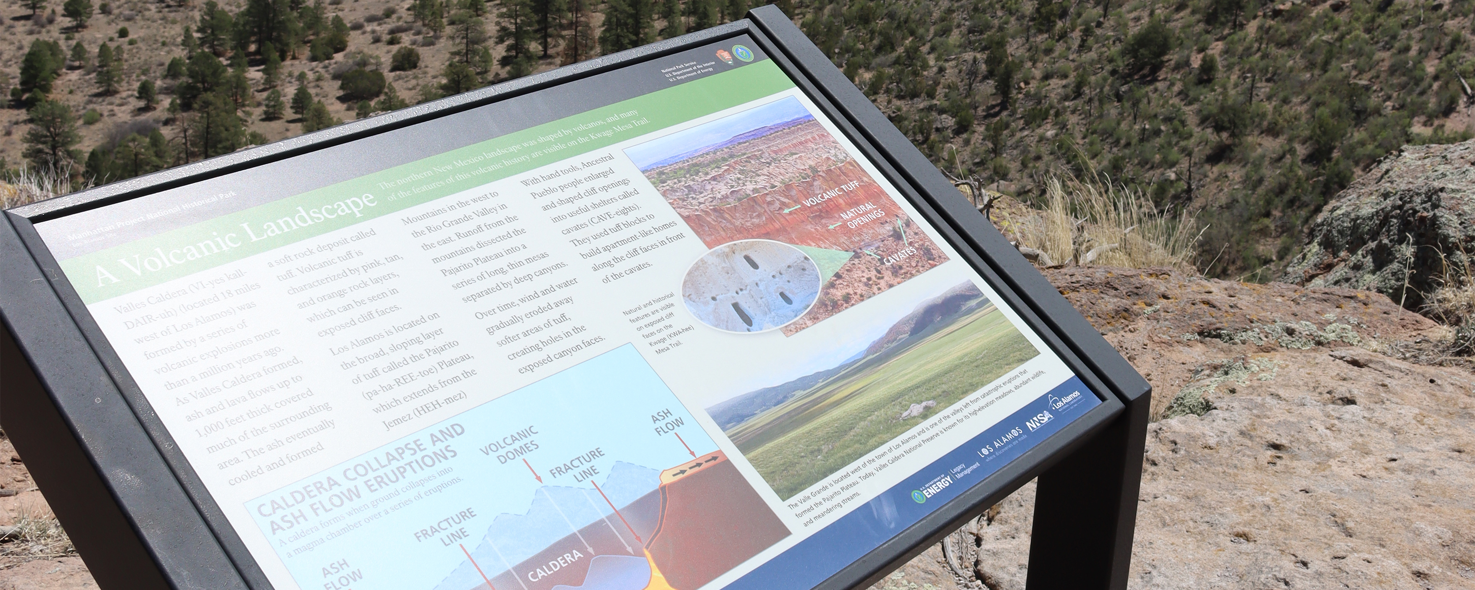 A wayside overlooking a rocky cliff in the New Mexico mountains.