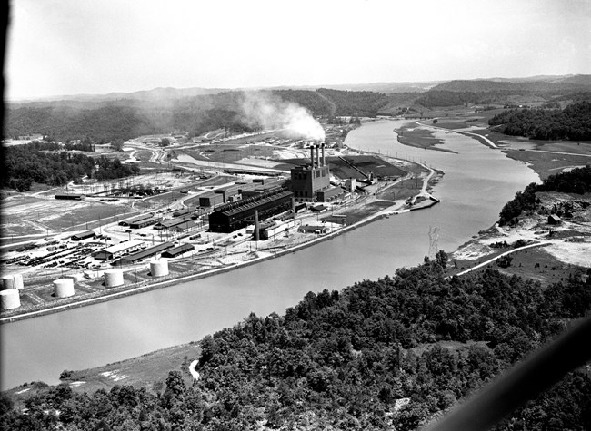 Aerial photo of the Clinch River bending around an industrial site, the K-25 Powerhouse and S-50 plant.