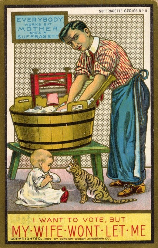 An anti-suffrage postcard depicting a man doing laundry with a baby in a high-chair with the phrase "I want to vote but my wife won't let me!"