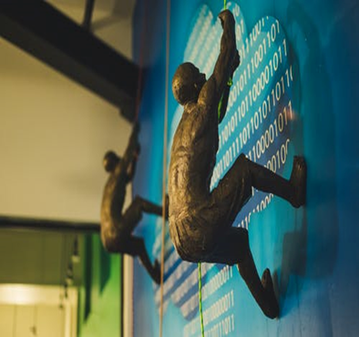 End page art piece of men climbing a wall