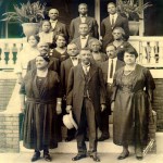 Mrs. Walker and 14 colleagues on the front steps of her home