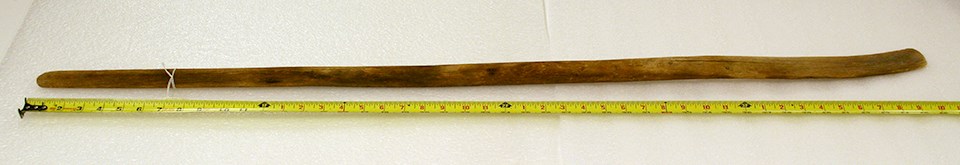 A straight wooden pole between 3-4 feet in length.