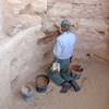 Park ranger archeologist repairs a kiva wall in Long House.