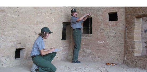 Two archeologists working in Spruce Tree House.