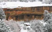 View of Spruce Tree House surrounded by snow in the winter.