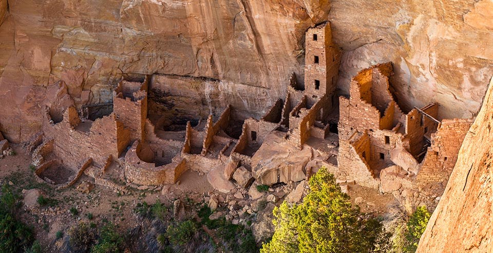 View of multi-room masonry cliff dwelling from above.