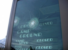 Damage from shots fired at entrance gate