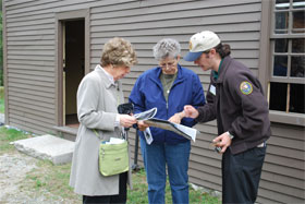 Park volunteer assisting visitors at one of the park's April 19, 1775 "witness" houses Park volunteer assisting visitors at one of the park's April 19, 1775 "witness" houses