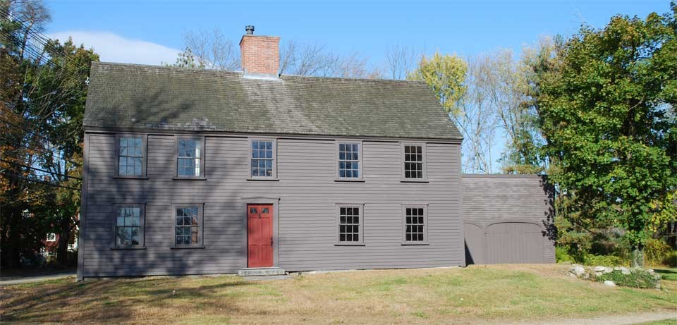 Two story dark gray colonial house