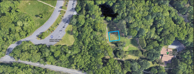 Arial photo of Minute Man Visitor Center campus with a blue box marking the location of a first amendment area