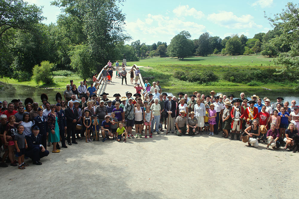 Visitors, reenactors, military at North Bridge