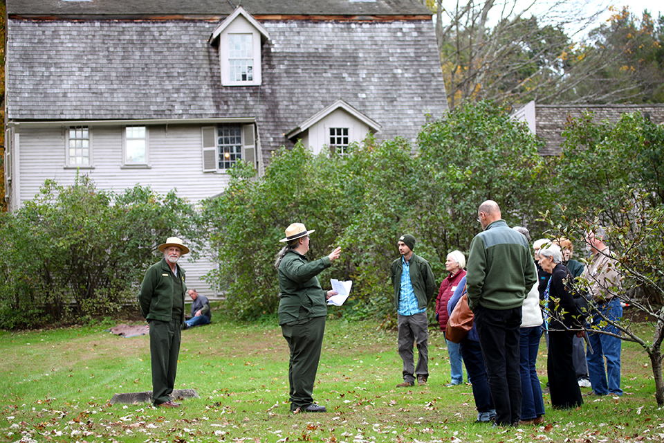 Rangers talk to visitors behind The Old Manse, Concord, MA Rangers talk to visitors behind The Old Manse, Concord, MA