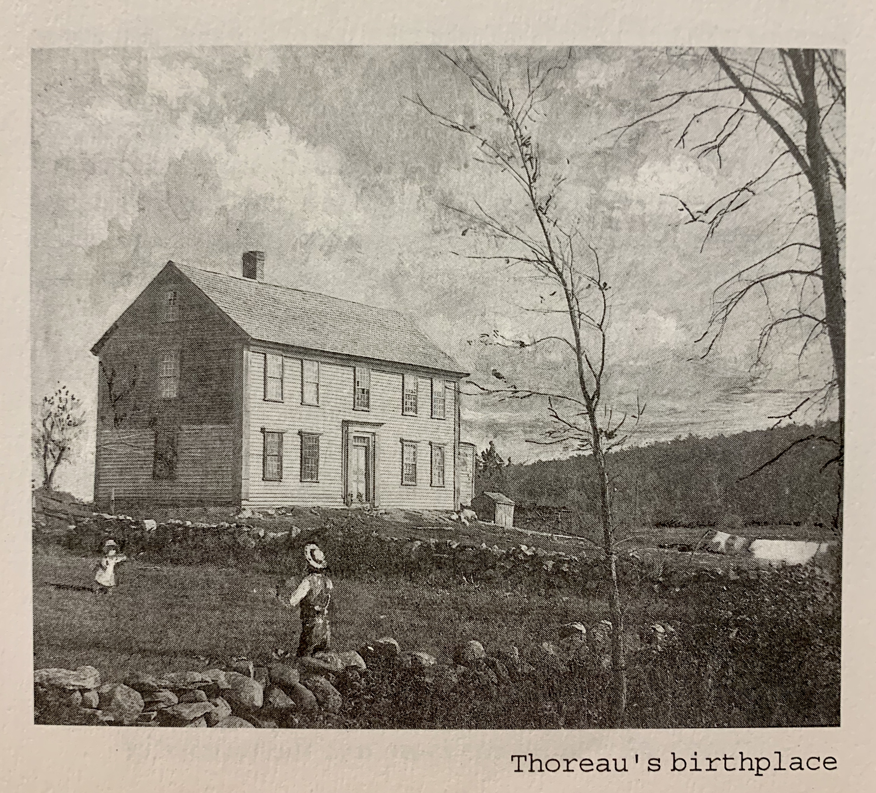 Black and white image of a colonial style come with rock walls and people playing in a yard.