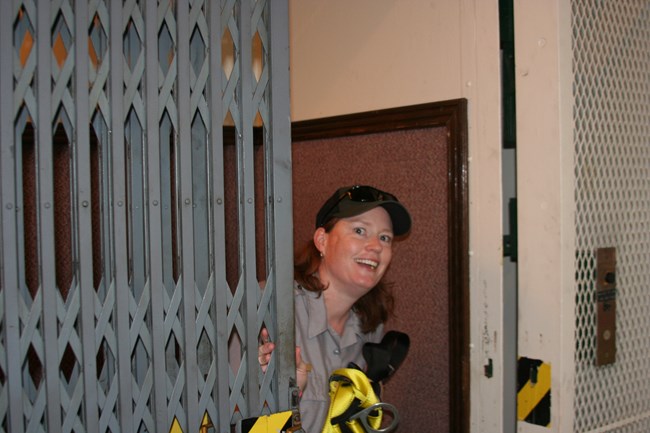 Woman park ranger in historic elevator