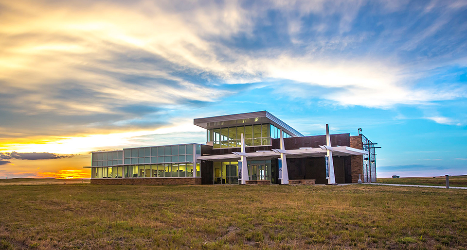 MIMI-VC-nrcrop Building on a prairie at sunset
