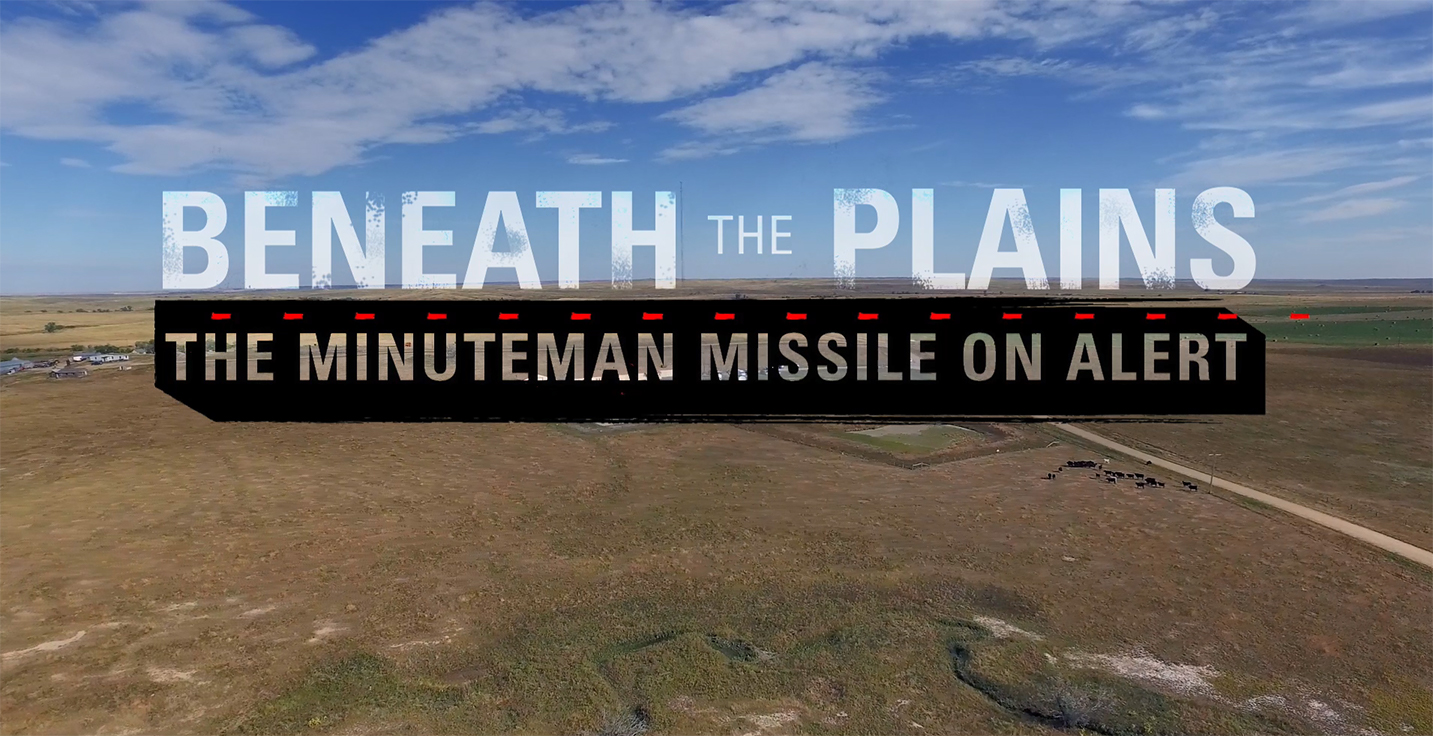 Title "Beneath The Plains" superimposed over prairie landscape Title "Beneath The Plains" superimposed over prairie landscape
