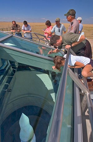 A park ranger talks with visitors at the top of the Delta-09 silo.