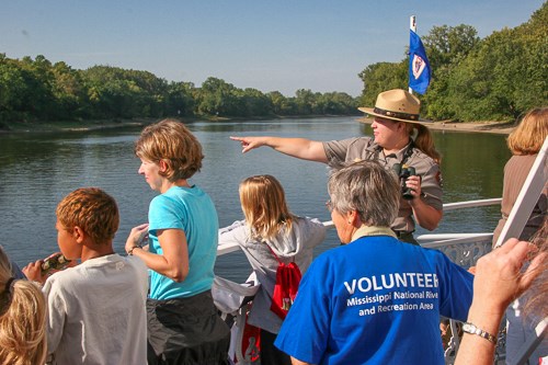 Birding on Big River Journey A ranger points towards a feature being learned by students.